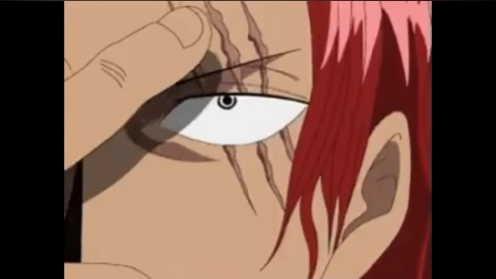 Shanks menunjukkan bekas luka di wajahnya. [YouTube Anime Haki]